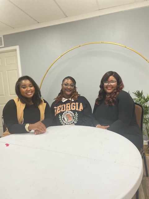 Erika Nicole with attendees at a live business event
